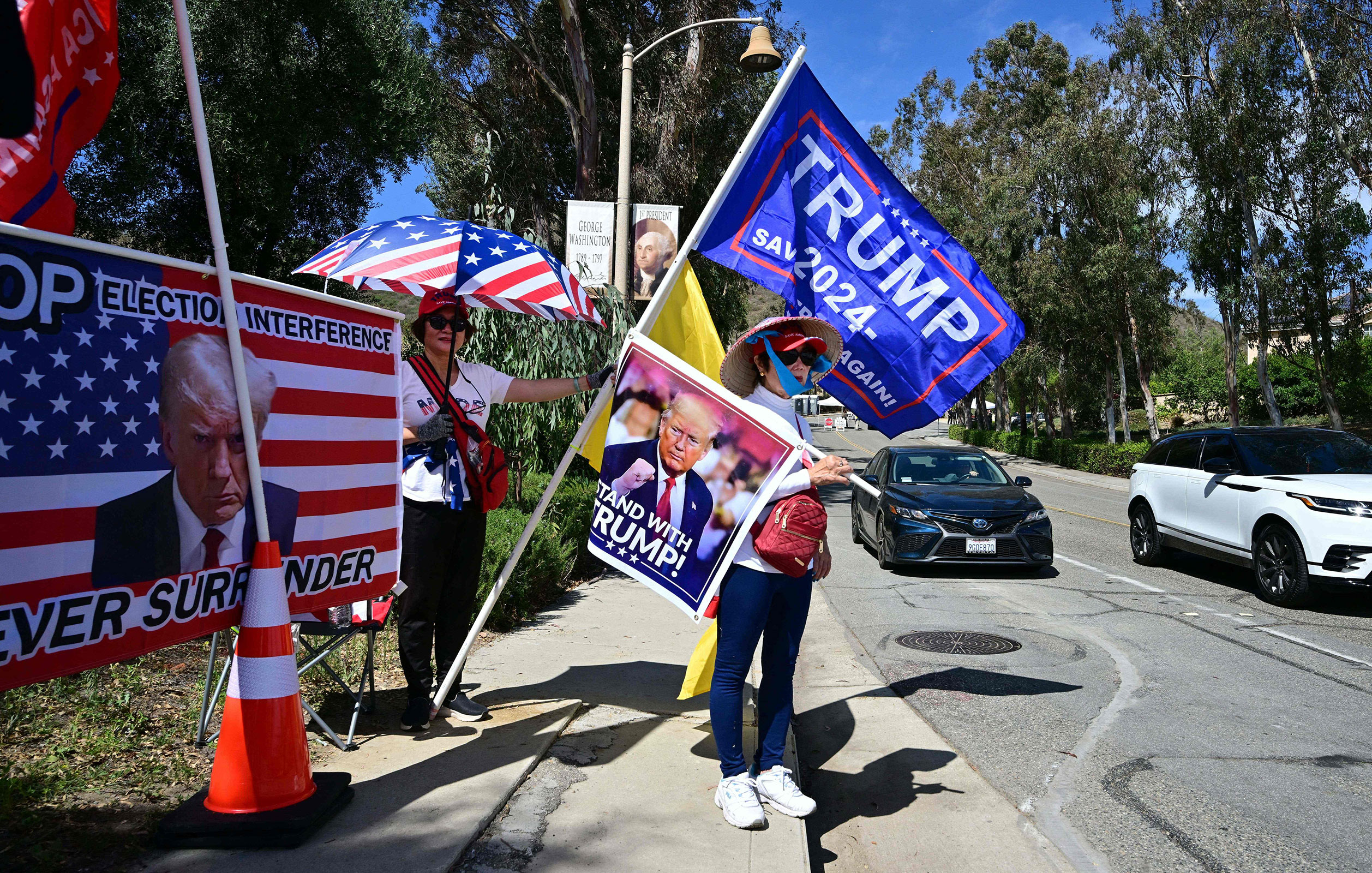 Supporters of former President Donald Trump gather near the entrance to the Ronald Reagan Library in Simi Valley, California, on September 27, 2023, ahead of the second Republica primary debate which the former president will not attend.